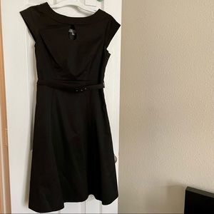 Formal below knee, black dress.